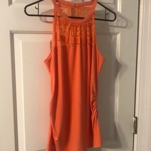 Orange woman’s blouse lace trim